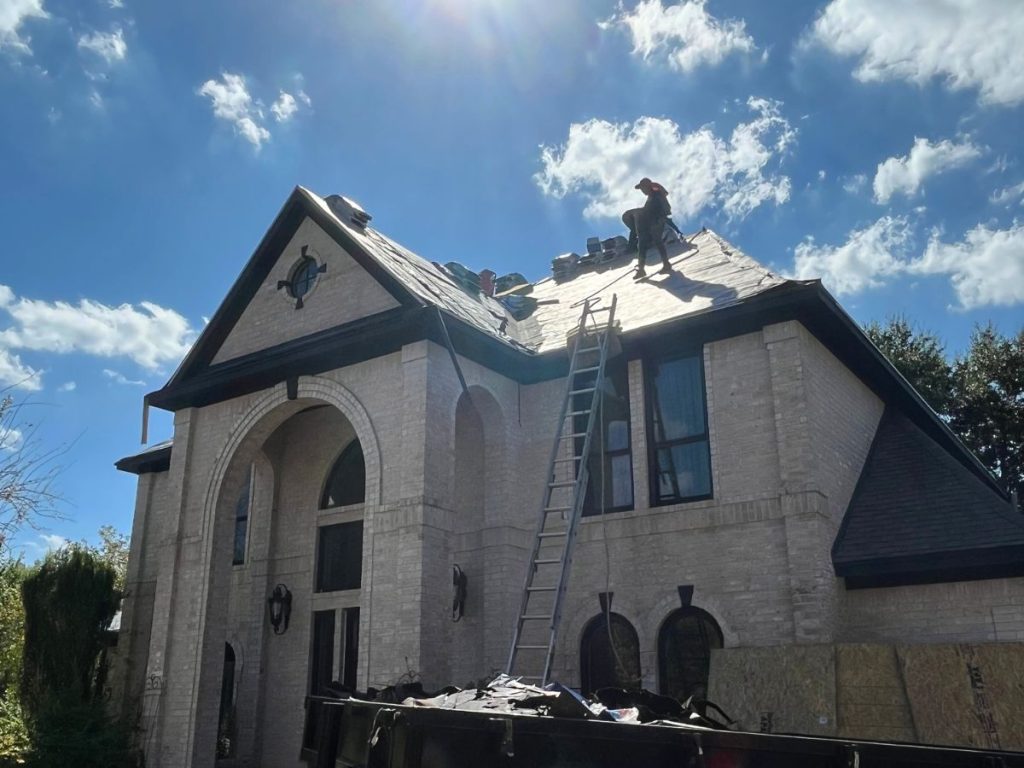 our workers on a tall house roof